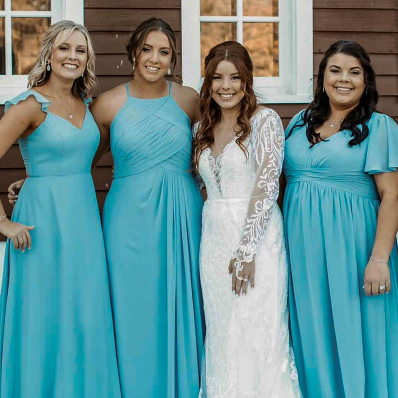 Bridesmaids and bride posing for the camera, wearing their Shine Shade in Medium.